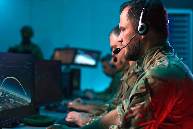 Military commander using computer during conflict