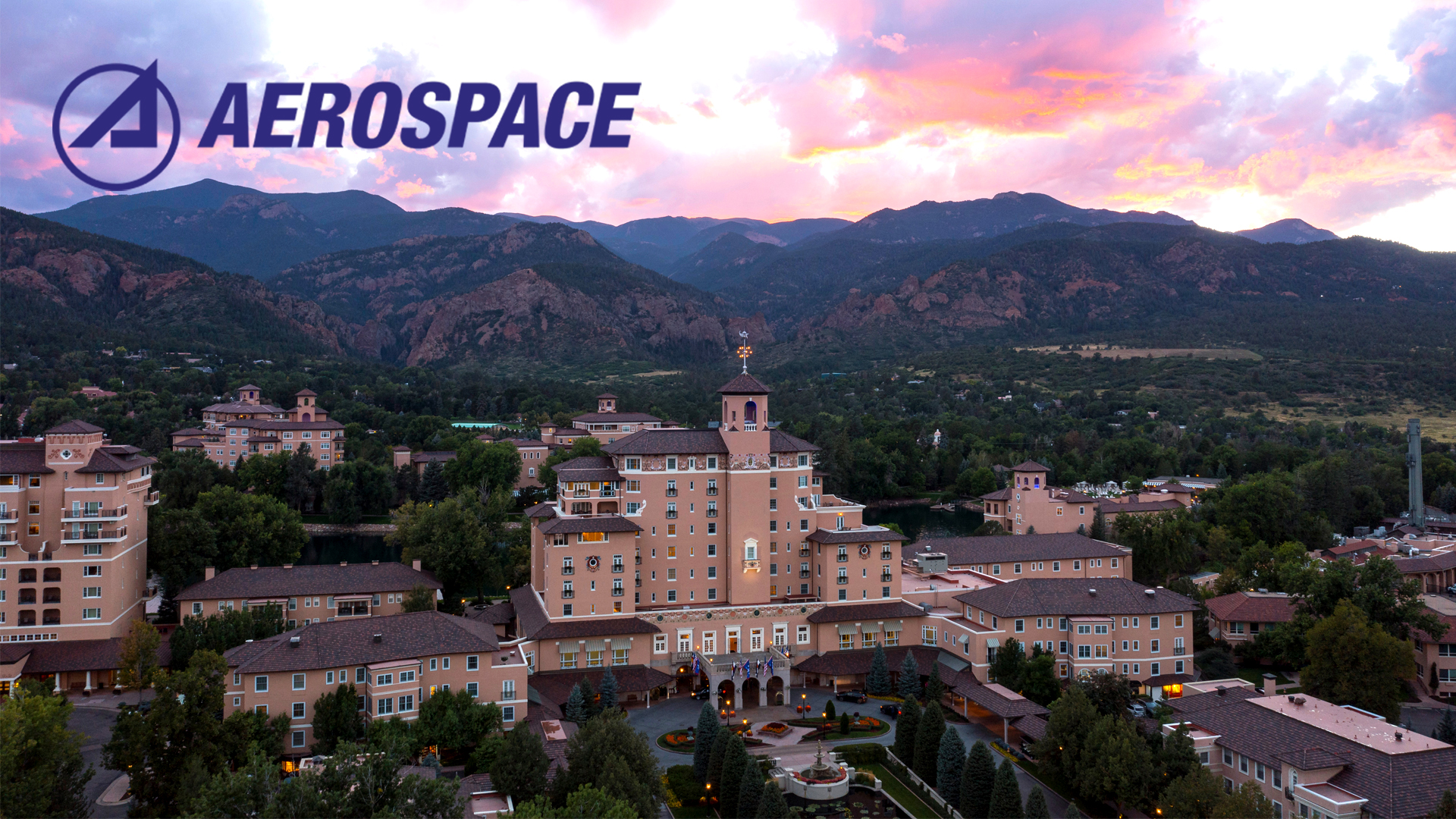 The Aerospace Logo above an aerial image of the Broadmoor Hotel in Colorado Springs.