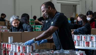 Man organizing cans at LA Food Bank.