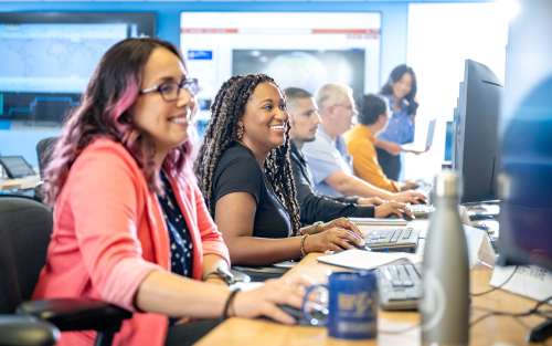 People in a computer lab working.