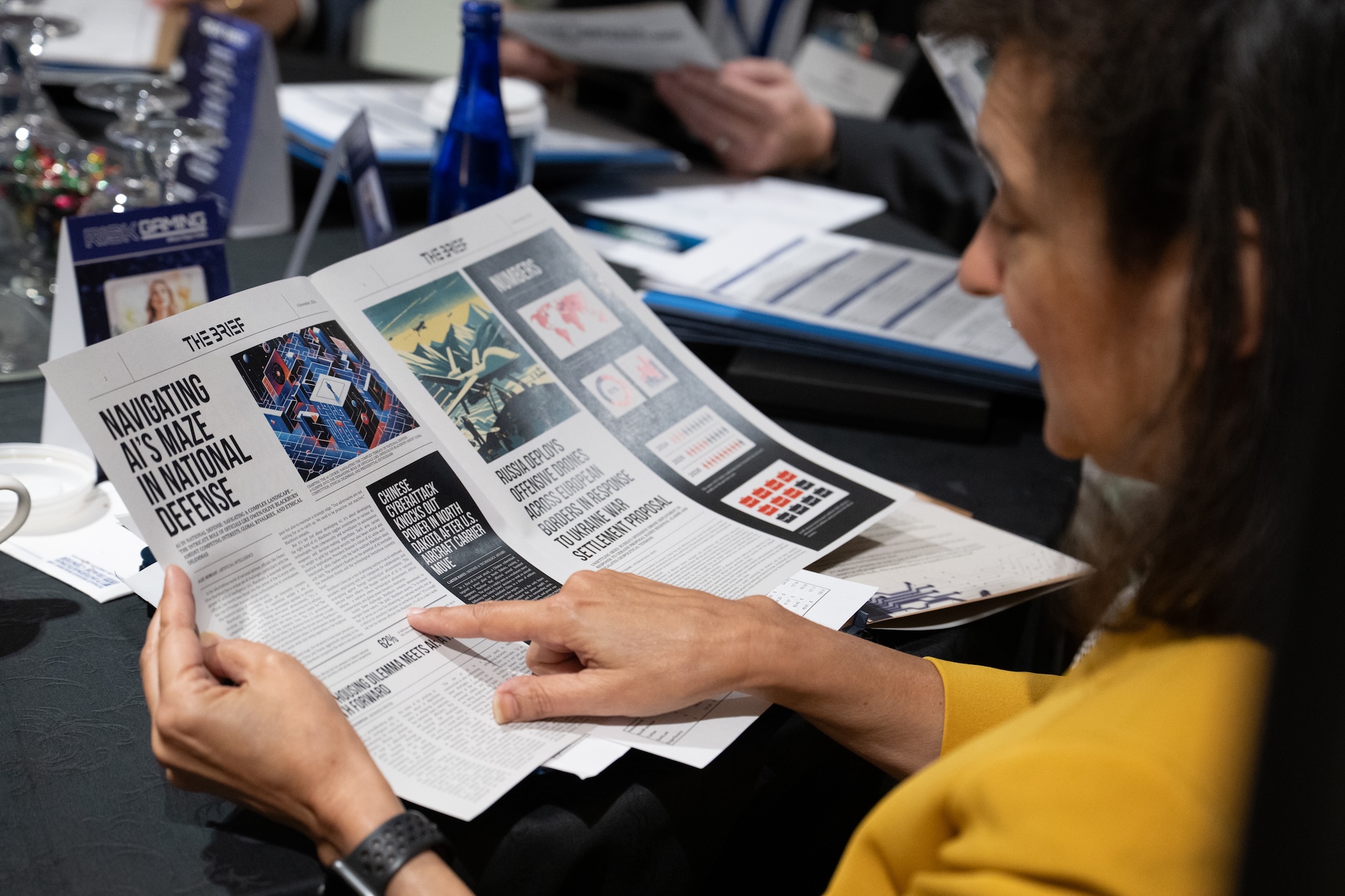Aerospace COO Tanya Pemberton looks over game materials at a DC riskgaming exercise