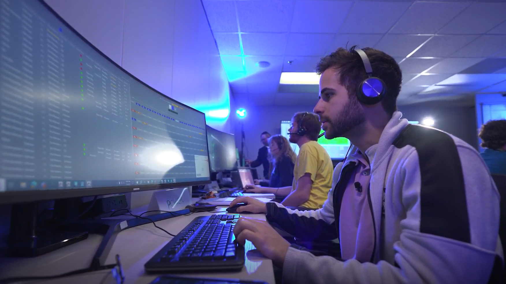 Man using a computer to participate in wargame.